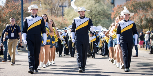 Pride of the Rockies marching band walking into a football game.