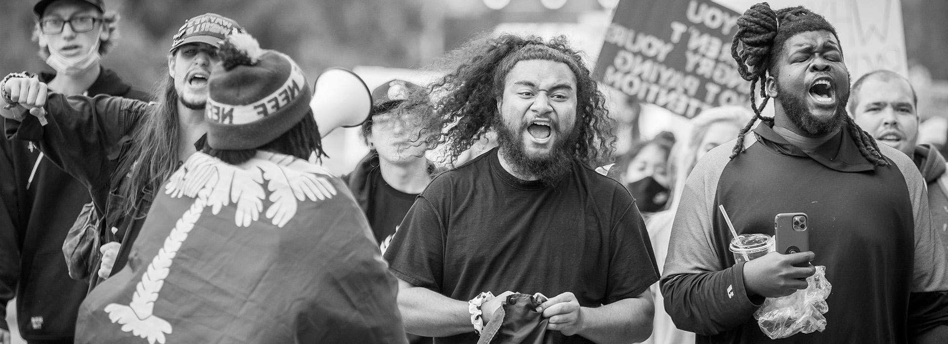 Two men chant during the juneteenth march.