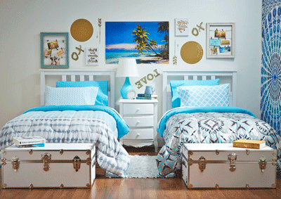 Two twin beds in a decorated residence hall room