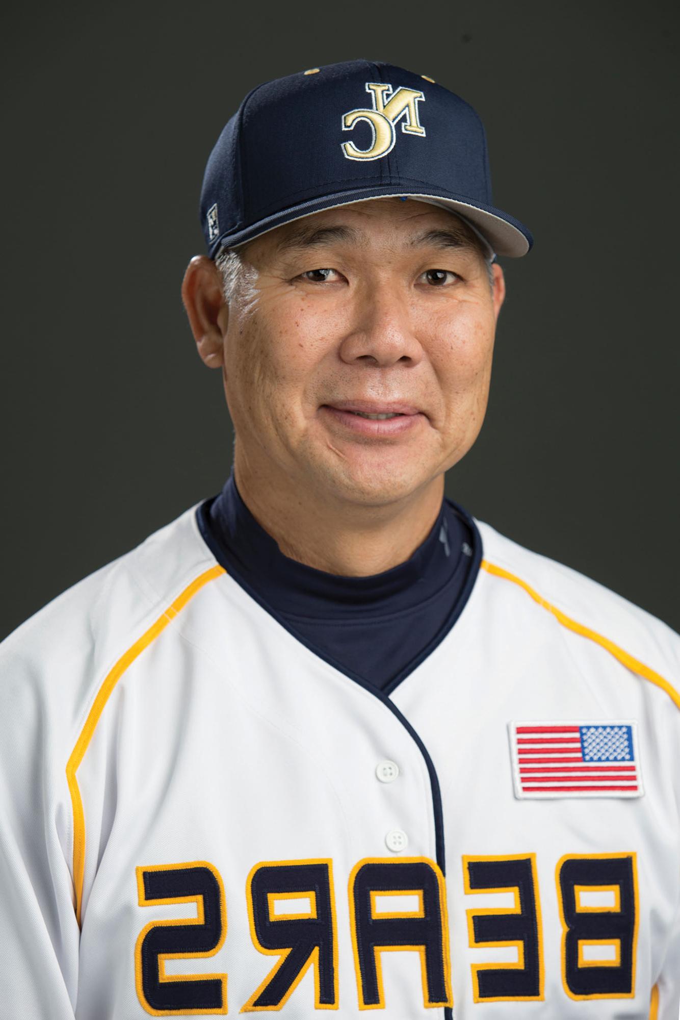 Headshot of Coach Carl Iwasaki.